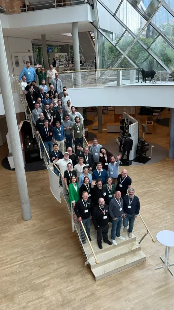 Attendees of CMS Summit 26 on the staircase of the Museum für Kommunikation, Frankfurt
