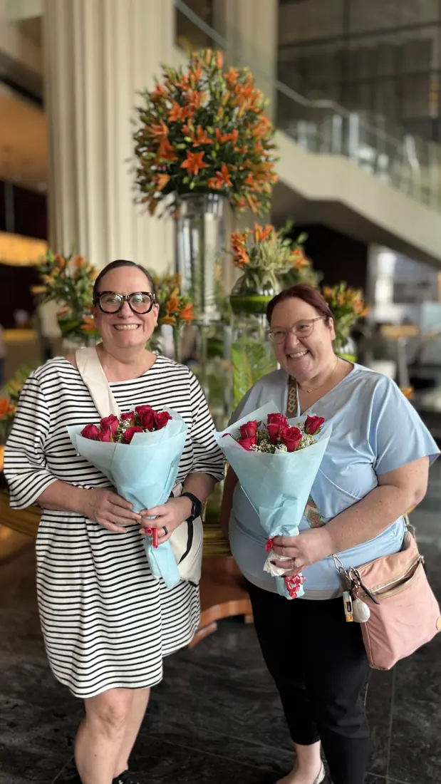 Two visiting clients welcomed with flowers in Pune