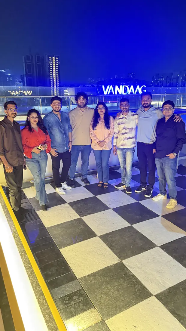 Digiteins team members on a rooftop in Pune at night